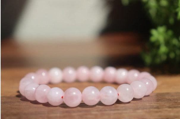 Pulseira Quartzo rosa, esferas de 6mm e 8mm pedras naturais.